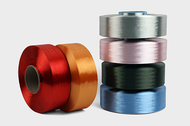 How Does the Denier Count of Polyester FDY Yarns Impact Their Versatility and Applications in the Mark Industry?